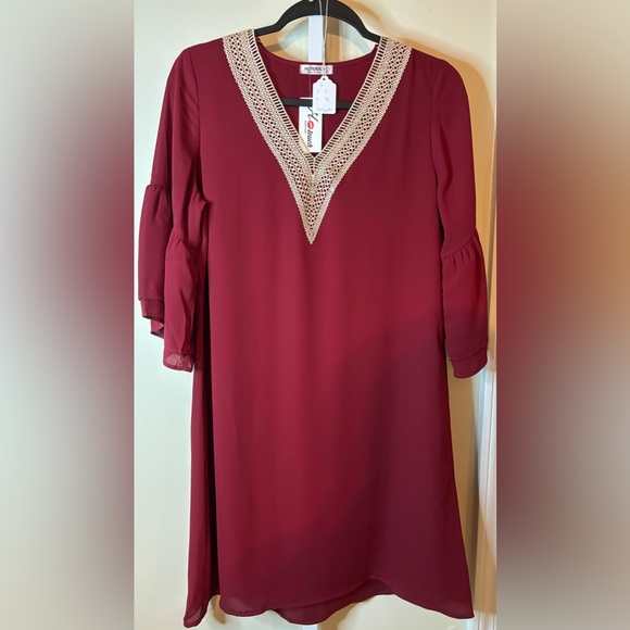 Dresses & Skirts - Small Wine colored Dress with Embroidered V-neck line
